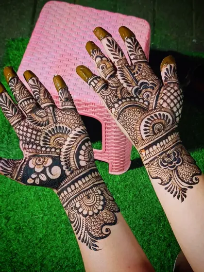 A dense and detailed Indian mehandi design, showcasing a variety of traditional patterns.