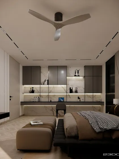 A bedroom in the Meraki residence that includes an integrated study nook. The dark cabinetry and backlit marble create a sleek and functional workspace without compromising the room's serene atmosphere.