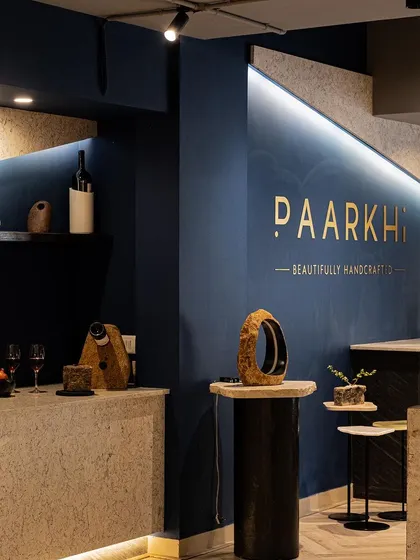 This image captures the sublime ambiance of the boutique, where the sleek lines of the bar and reception counters harmonise with the natural beauty of the stone materials. The lighting design was crucial in creating this serene and opulent feel.