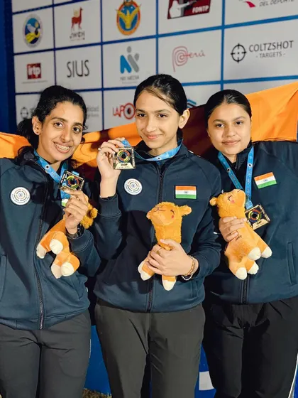 Our victorious junior women's team proudly displaying their medals at the ISSF World Championship. Their success is a testament to our focused training on advanced shooting techniques.