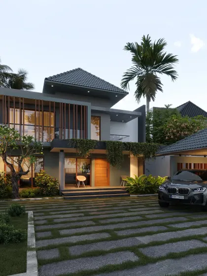 A home in Iritty with a complex roofline, vertical wooden screens, and hanging greenery over the main entrance.