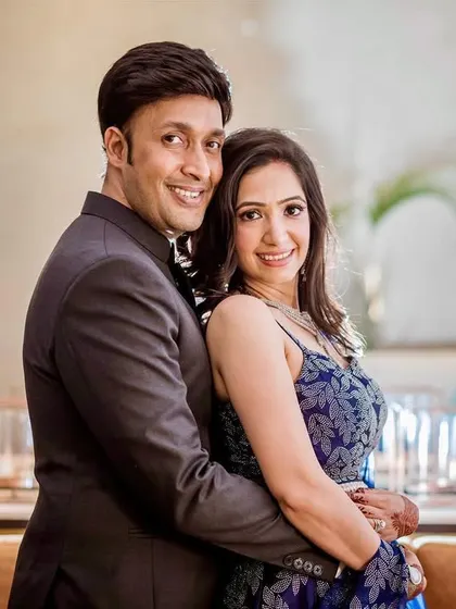 A classic, elegant couple portrait. The soft lighting and the couple's relaxed pose create a timeless image from their engagement.