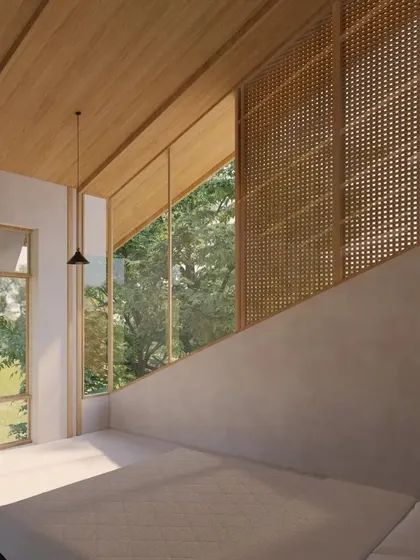 A render of a bedroom in our Cumin Residence project. The design uses large, angular windows and natural materials like wood and woven screens to create a serene space that feels completely integrated with the lush Goan landscape.