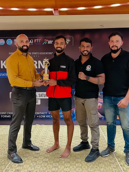 A proud moment as one of our UMC Warriors receives a trophy for his outstanding performance. We celebrate every victory as a team.