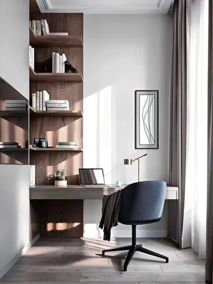 We created a minimalist and serene study corner in this room. The design features a simple floating desk, corner bookshelves in a warm wood finish, and a sleek white wardrobe, making the most of natural light from the adjacent window.