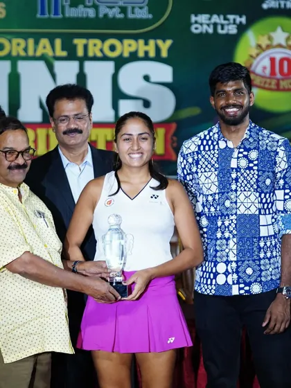 A duplicate image capturing the proud moment of our player receiving her singles trophy at the AITA Women's Open.