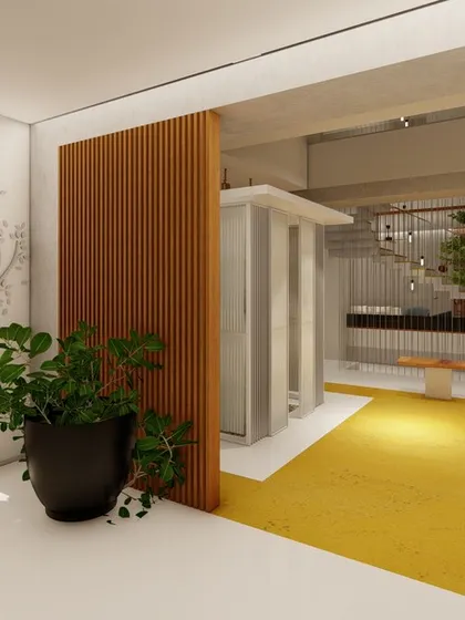 This view shows the entrance foyer leading into the central courtyard. A slatted wood screen provides a visual separation while maintaining the open, airy feel of the overall space.