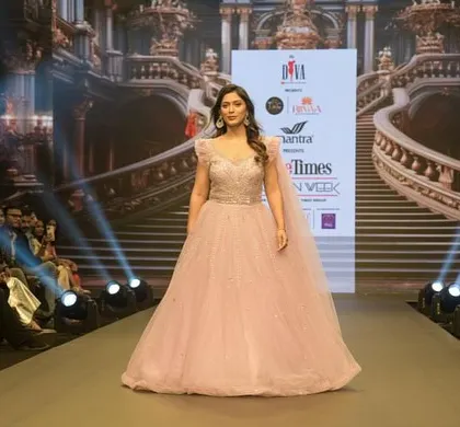 A full front view of the Muave Pink ball gown on the runway at Pune Times Fashion Week. This piece from my "Jashn-e-Ishq" collection celebrates love and beauty in every shape.