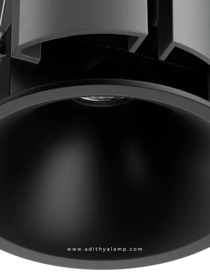 A product shot of our downlight featuring a matte black reflector and trim. This option is ideal for creating a more dramatic lighting effect, as the black finish absorbs stray light and provides a highly focused, low-glare beam.