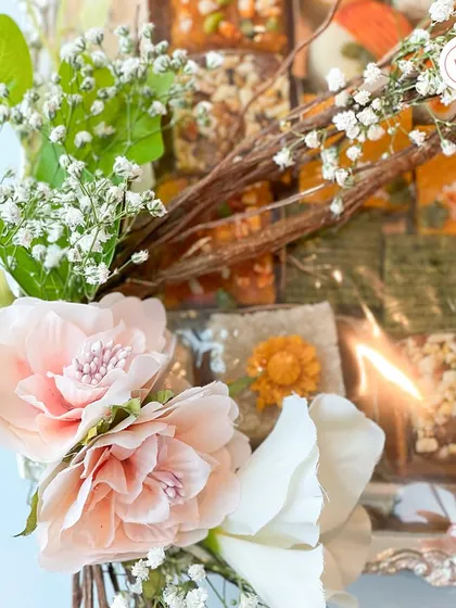 A close-up detail of the mithai hamper, showing the soft pink and white flowers against the rich textures of the Indian sweets. It’s this interplay of elements that makes the hamper feel so special.