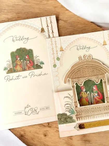 This single-pager invitation features a stunning 3D pop-up of a royal Jharokha. It's a simple yet incredibly effective way to make a statement.
