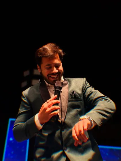 Checking the time with a smile, but the party is far from over. I'm always ready for the next performance or interactive segment.