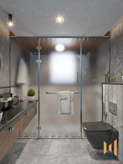 A bathroom with a grey monochrome design, featuring a floating wooden vanity and a frosted glass shower partition.
