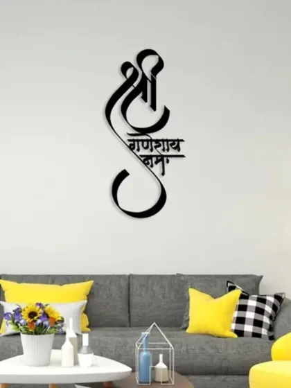 Make a statement with this "Shree Ganeshay Namah" metal wall art. The beautiful calligraphy and black finish create a piece that is both spiritual and modern, perfect for bringing blessings and grace to your home.
