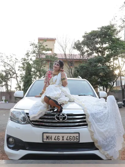 A fun and modern bridal shot, showing that today's bride is confident and full of personality. The beautiful makeup and traditional attire look stunning in any setting.