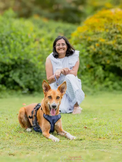 Coco enjoying a quiet moment with her mama in the park. The contrast with her more alert sibling photos shows the different sides of her personality.