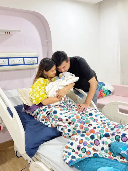 The moment our rainbow baby arrived. This photo captures the overwhelming joy and relief in the hospital room, a memory I will cherish forever.
