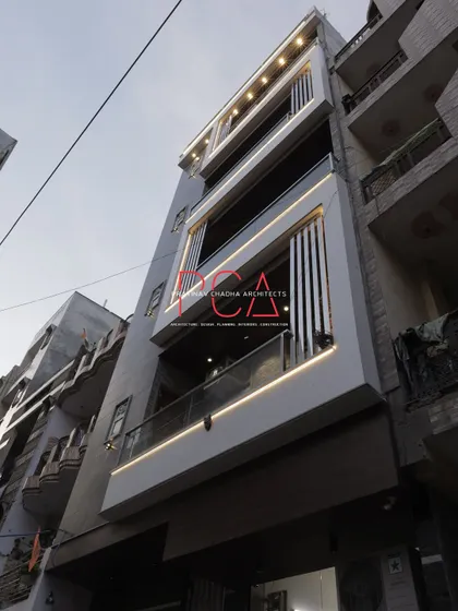 A low-angle day shot of The Cursive Abode, capturing the morning light on the facade's modern architectural features.