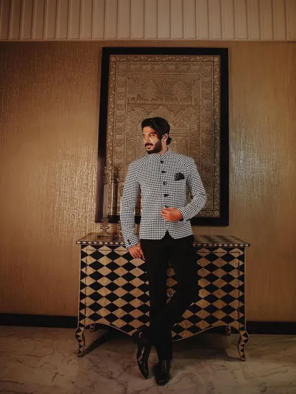 A full-length shot of Dulquer Salmaan in his classic yet contemporary Shahab Durazi bandhgala.