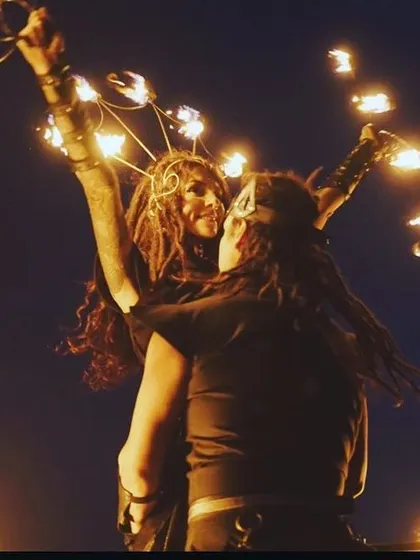 An artistic and intimate moment from a duo fire performance. This image captures the connection and trust between our artists as they perform together.