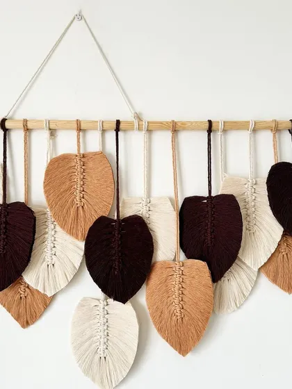 Another angle showcasing the craftsmanship of this custom feather wall hanging.