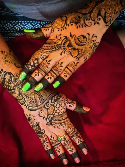 A bold Indo-Arabic design with a mix of paisleys and floral patterns. The dark, crisp lines create a striking look that is perfect for any celebration.