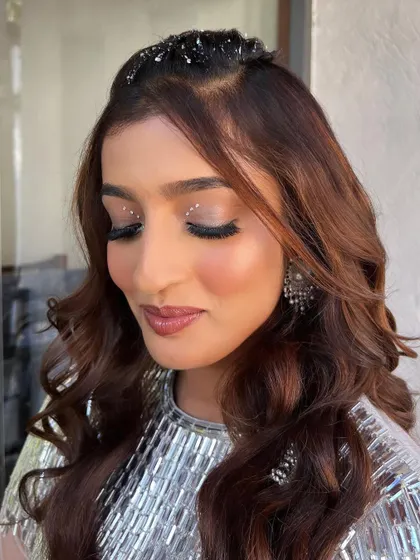 A close-up of the eye makeup, featuring carefully placed crystals for that extra sparkle. The hair is also adorned with glitter to complete the Tomorrowland theme.