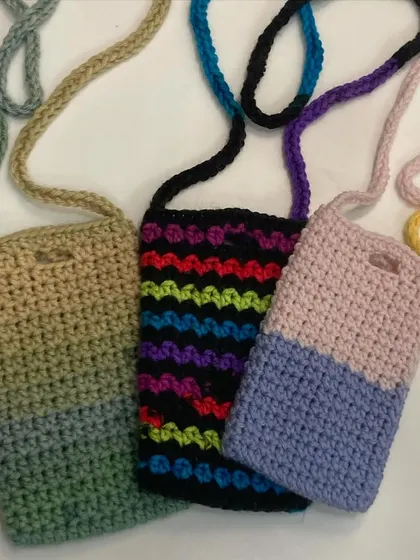 A collection of my adorable and colorful phone slings. They are perfect for when you want to be hands-free but still keep your phone close and accessible.