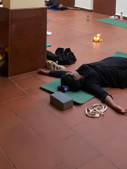 Another angle from a beautiful workshop, showing everyone in their own state of deep rest. The goal is to feel, not to perform.