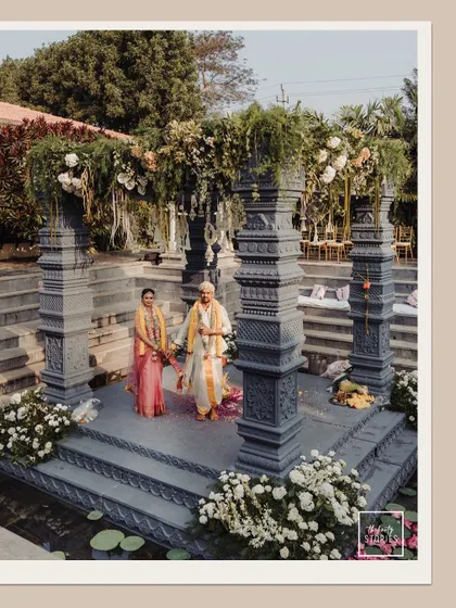 A wide-angle view of the stunning stone mandap, showcasing the grandeur and unique architecture of the wedding venue.