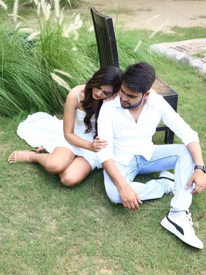 A sweet and intimate shot from a pre-wedding shoot, featuring our versatile white dress.