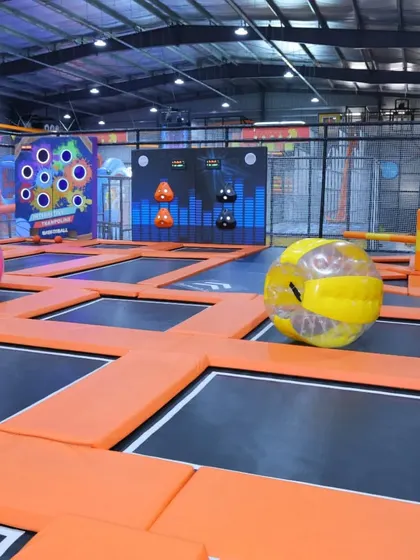 Our trampoline park includes fun obstacles like these giant inflatable zorbing balls, adding another layer of excitement to the experience.