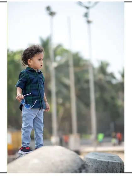 A vertical composition from the beach photoshoot, capturing a quiet moment of observation.