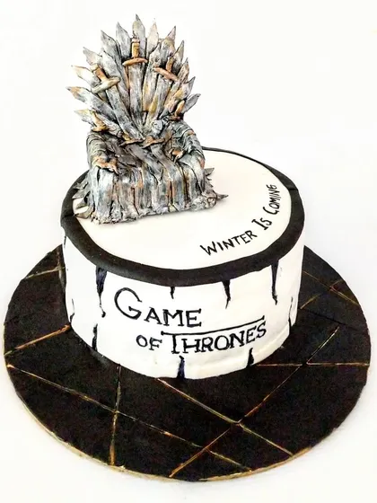 For the ultimate Game of Thrones fan, I handcrafted this Iron Throne cake. Every single sword on the throne was individually sculpted from fondant to create a centerpiece worthy of a king. This is a rich chocolate hazelnut cake, proving that intricate designs can also be incredibly delicious.