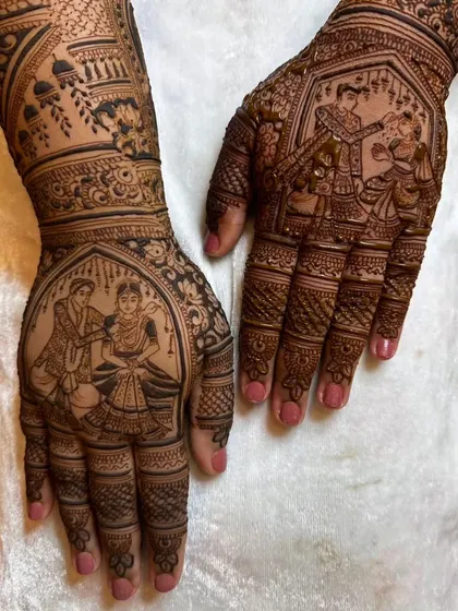A closer view of the palm work from a full bridal set. This image highlights the detail in the couple's figures during a wedding ritual.
