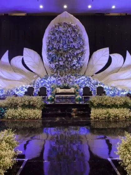 This is the kind of stage that makes a statement. For this corporate awards night, I designed a massive, glowing lotus structure that created a truly memorable backdrop. The reflective flooring and precise lighting made the entire setup feel modern and grand.