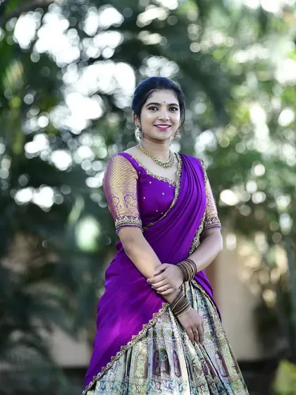 A smiling portrait of Dr. Nikitha, looking confident and beautiful in her custom creation.