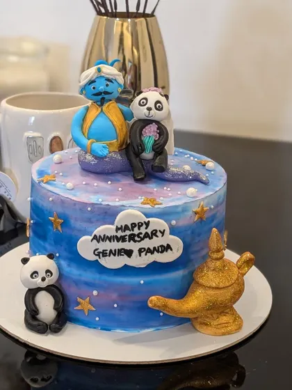 A magical anniversary cake featuring a fun "Genie and Panda" theme. I created custom fondant figures of the couple's cute nicknames.