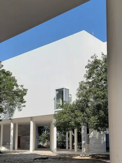 Glimpses of our ongoing project for the Koba Jain Museum. The pristine white structure is lifted on stilts and nestled among existing trees, creating a serene pavilion that invites community interaction and feels light upon the earth.