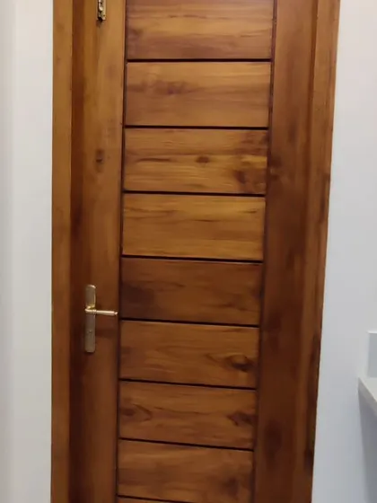 A finished solid wood door, showcasing clean lines and quality craftsmanship.