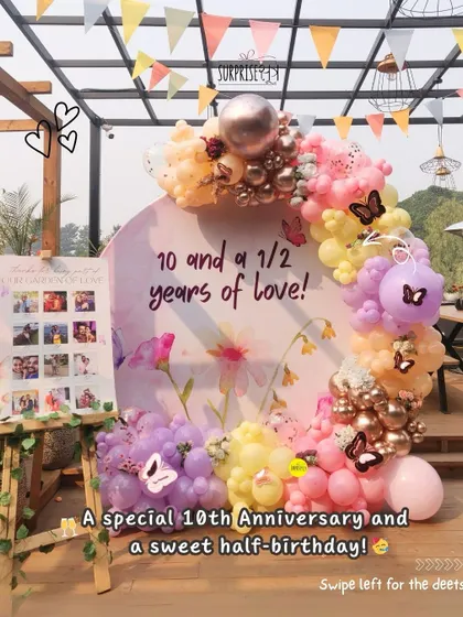 A special celebration for 10 and a half years of love and a baby's half birthday combined! This custom floral print backdrop with a pastel balloon arch was the centerpiece of a unique family milestone.