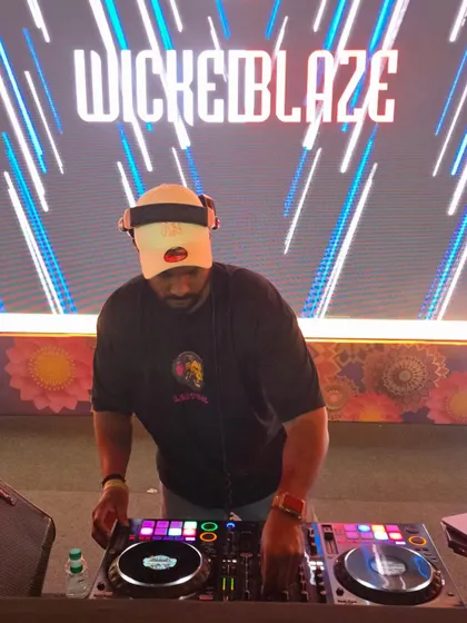 A clear shot of me working the Pioneer DDJ-1000 controller at a corporate function. Professional gear ensures a flawless performance every time.