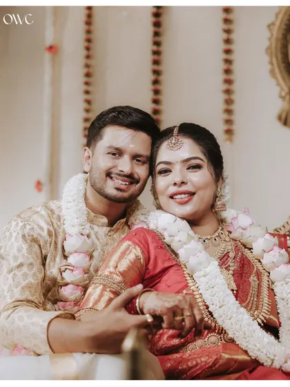 A happy close-up of a newly married couple, their faces beaming with joy.