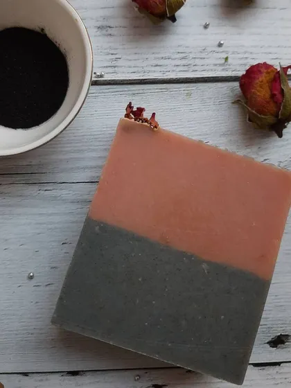 This angle highlights the smooth texture of the Charcoal Rose soap. Each bar is cured for several weeks to ensure it is hard, long-lasting, and gentle on the skin.