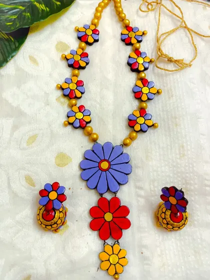 These are additional images of the floral necklace sets in various colors, showcasing the wide range of options available for bulk purchase.