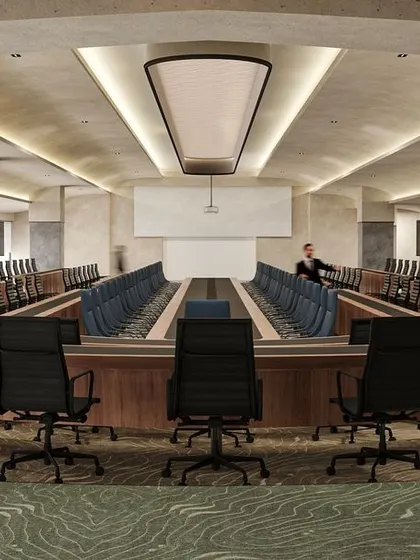 A duplicate image of the impressive conference hall, highlighting the meticulous planning of seating arrangements and technology integration.