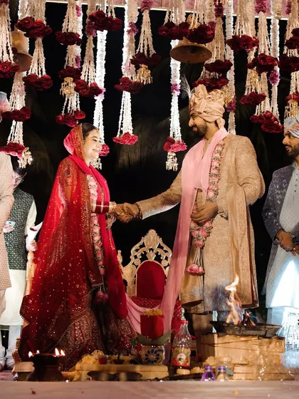 The 'saat phere' or seven vows around the holy fire. The mandap is designed to be open and visible, so all guests can witness this central and most important part of the wedding ceremony.