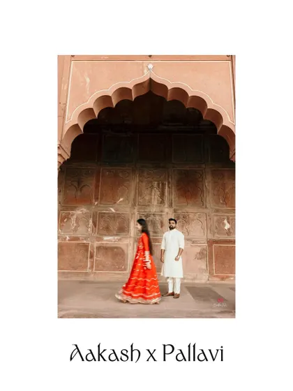 A pre-wedding portrait at the Taj Mahal, framed by the grand archway of the entrance. This shot creates a sense of grandeur and timeless romance.