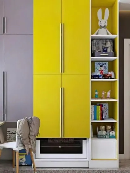 A vibrant kids' room with a bright yellow wardrobe and a compact study nook by the window. This design shows how I use color to create a playful atmosphere.