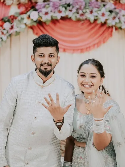The classic "we're engaged" photo! A happy, direct-to-camera shot where the couple proudly shows off their new rings is a must-have for every engagement album.